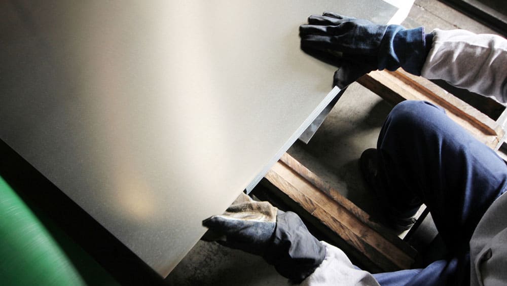 Sheet metal and gloved hands